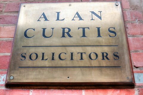 Alan Curtis Solicitors metal placard sign