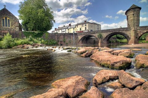 Monmouth bridge with Alan Curtis Solicitors law firm in background